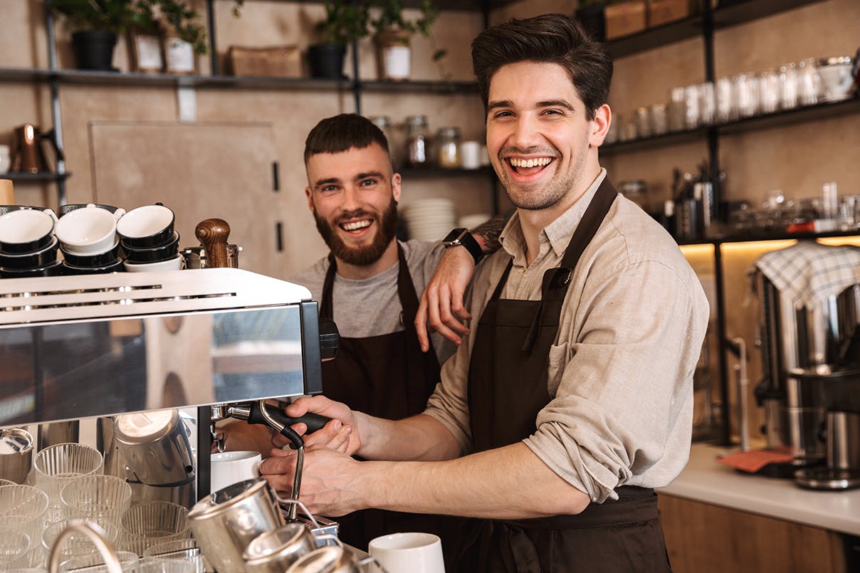Barista mit Kaffeemaschine Barista mit Kaffeemaschine