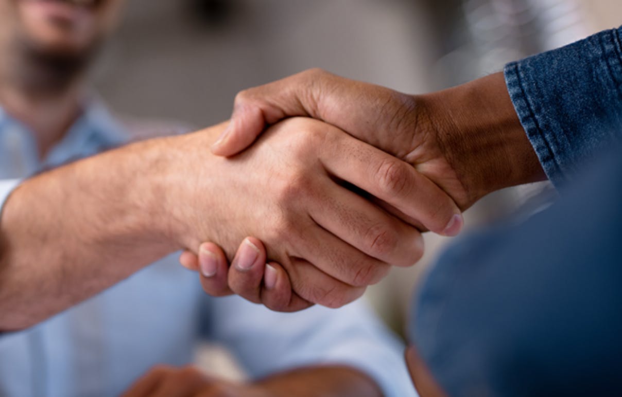 Handshake between business partners Handshake between business partners